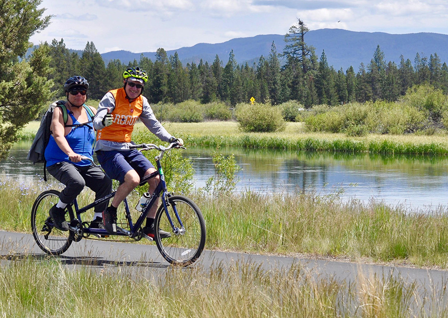 two cyclists on a tandem cycle