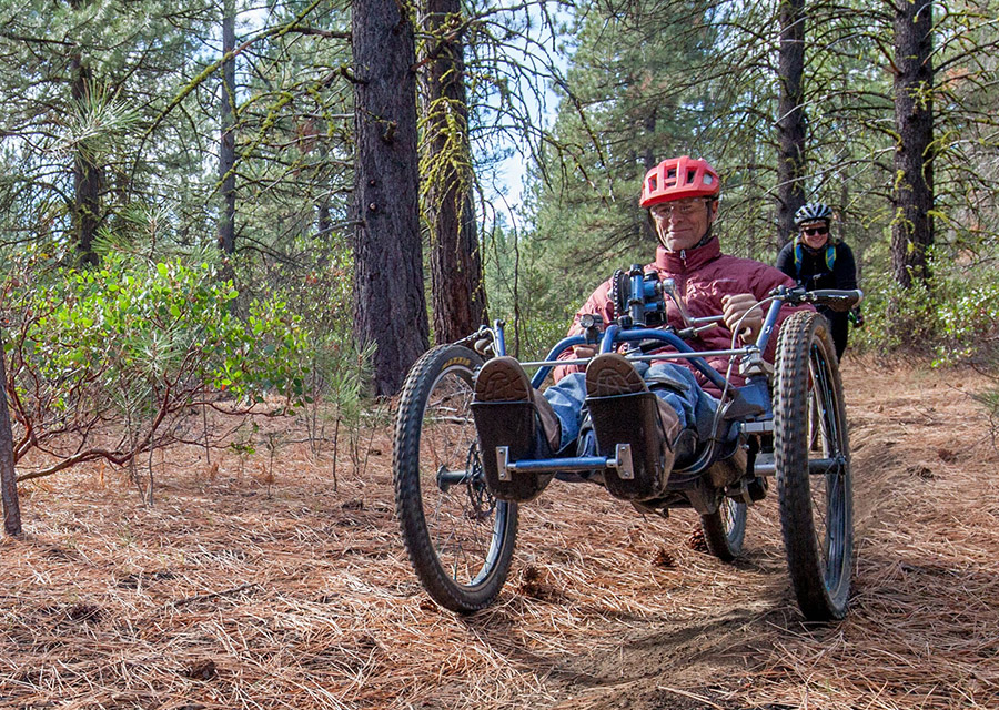 adult riding an off road handcycle