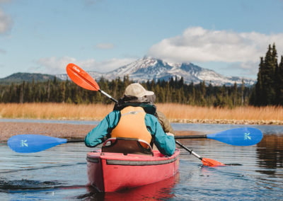 paddlers with mountains in background