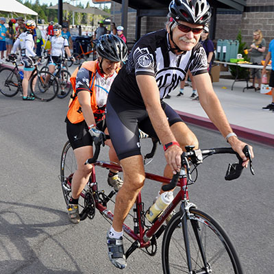 cyclist on tandem bike in race