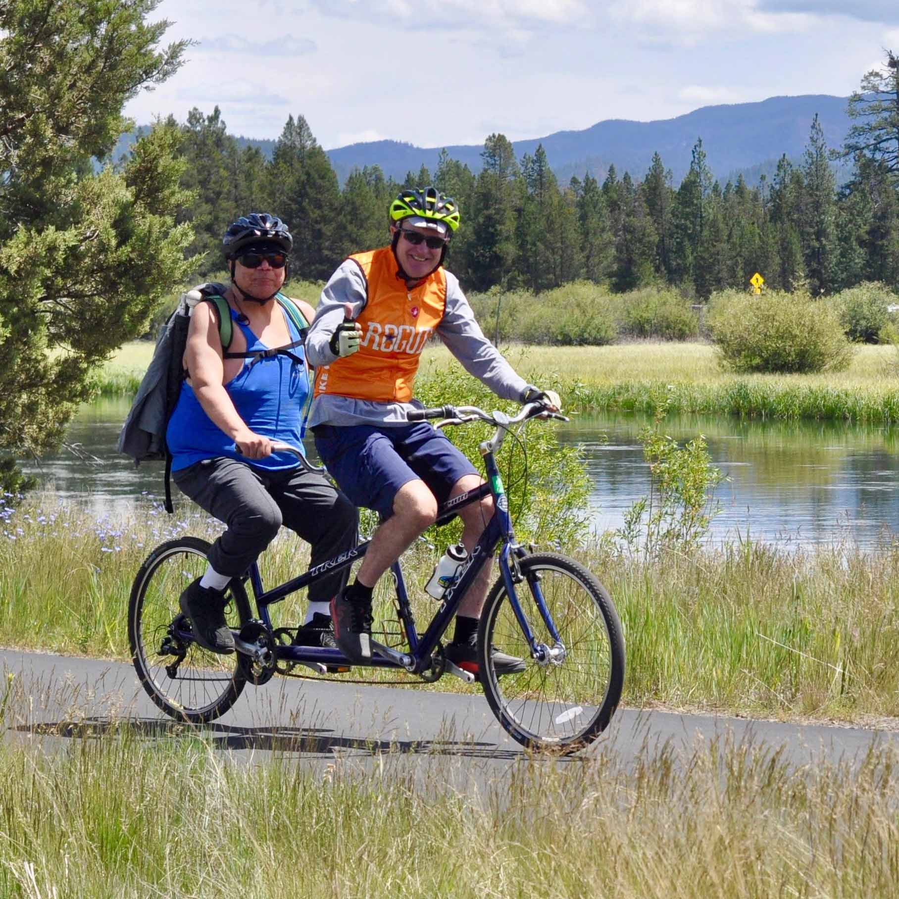 John Dulzo captaining a tandem bicycle