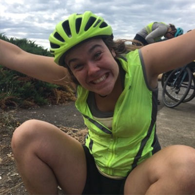 claire in cycling gear goofy and smiling