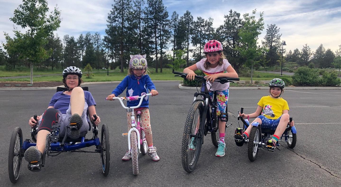 family on different bikes at pine nursery park