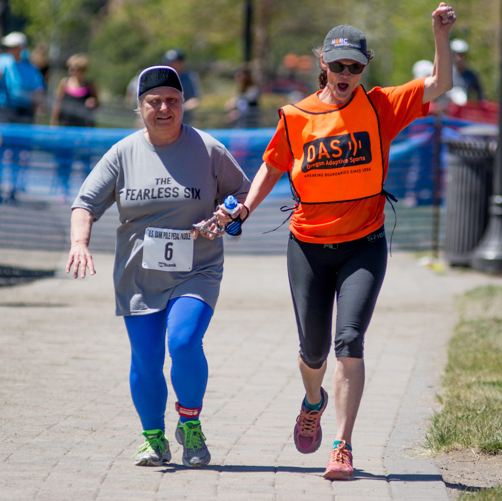 athlete sharlene and VI guide sue running at the PPP