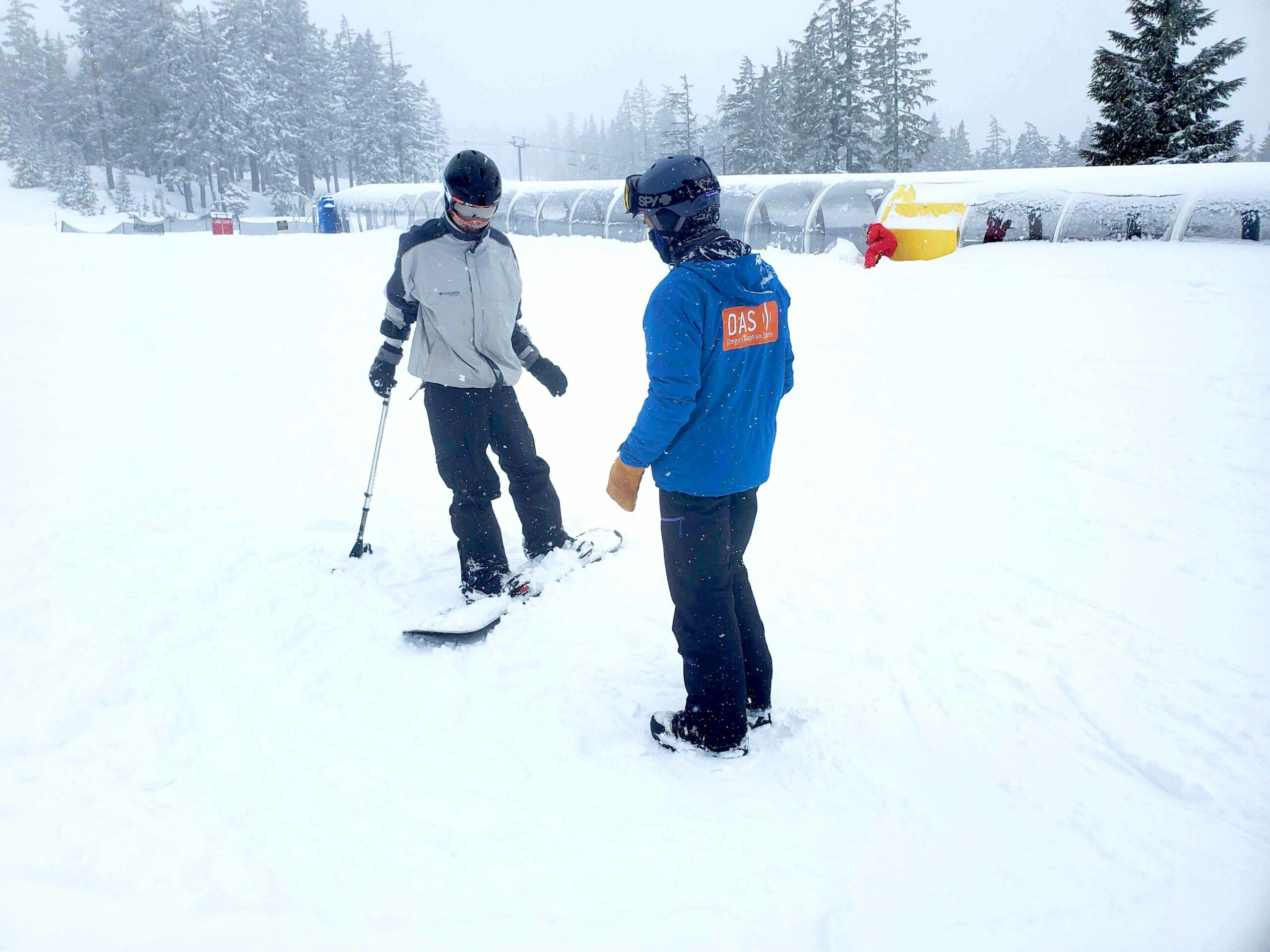 michael snowboarding with an OAS instructor
