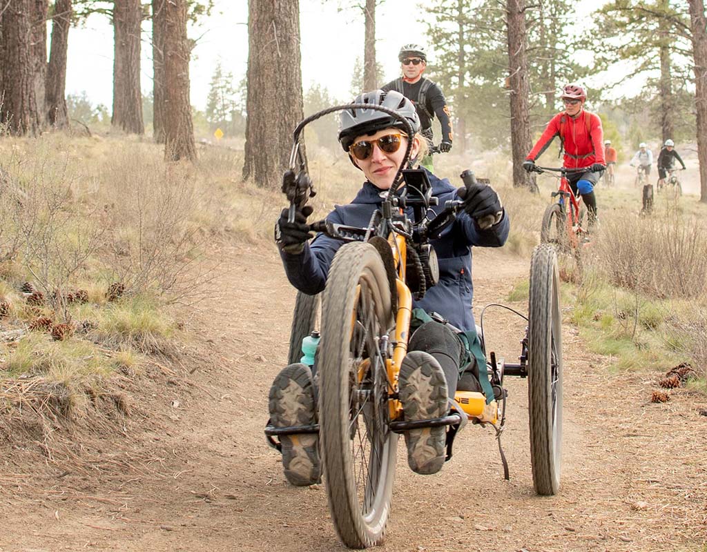 Woman riding an off road handcycle