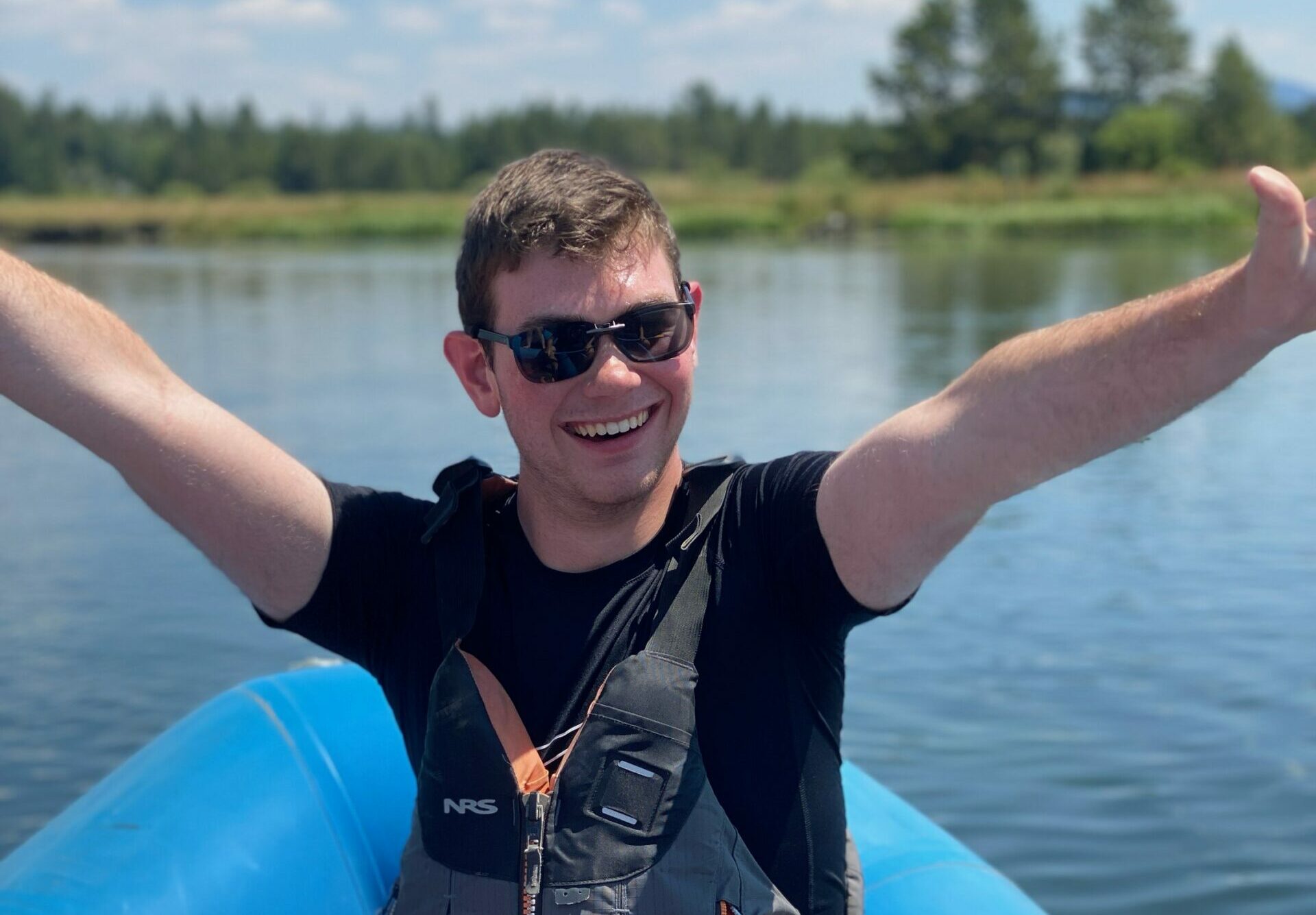 Kade in an inflatable boat on a lake