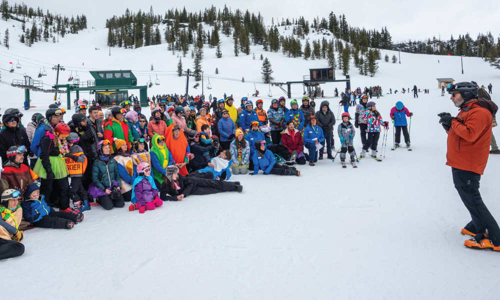 Group participating in JR Racers listen to an organizer as the event begins