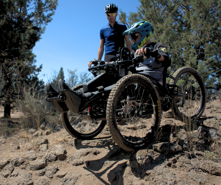 Max navigates a rocky decline from an adaptive bike
