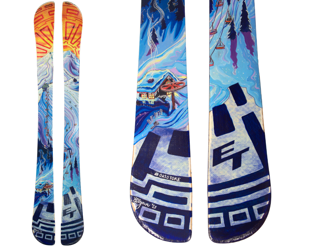 two skis on a white background. the skis have a whimsical painted desigin on them.