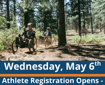 Forest trail scene; two people ride adaptive mountain bikes along a dirt path with a third rider farther back among the trees; visible text reads “Wednesday, May 6th” and “Athlete Registration Opens - Summer programs.”