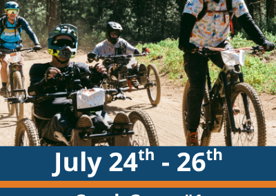 July 24th to 26th. Crank Camp number 1. aMTB Skills Camp. A group of riders move along a dirt trail in a forest, including people on adaptive three-wheeled mountain bikes and upright bikes, with trees and dust visible in the background.