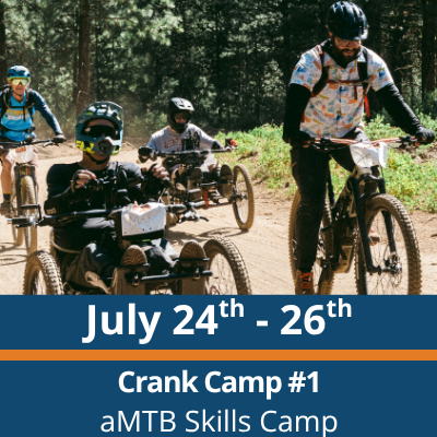 July 24th to 26th. Crank Camp number 1. aMTB Skills Camp. A group of riders move along a dirt trail in a forest, including people on adaptive three-wheeled mountain bikes and upright bikes, with trees and dust visible in the background.
