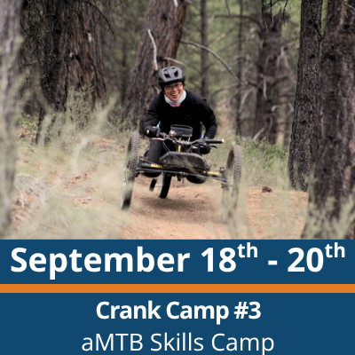 September 18th to 20th. Crank Camp number 3. aMTB Skills Camp. A person wearing a helmet rides a three-wheeled adaptive mountain bike along a narrow dirt trail through a forest, moving between tall trees with dry grass in the foreground.