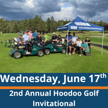 Golf course scene; a group of people pose together on and around golf carts under a blue canopy tent on green grass, with trees and cloudy skies in the background; visible text reads “Wednesday, June 17th” and “2nd Annual Hoodoo Golf Invitational.”
