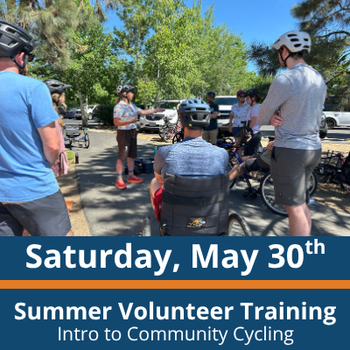 a group of people stand and sit in a circle with bikes and adaptive bikes, one person seated in an adaptive bike in the center facing an instructor who gestures while speaking; others stand nearby wearing helmets; text at the bottom reads “Saturday, May 30th,” “Summer Volunteer Training,” and “Intro to Community Cycling.”