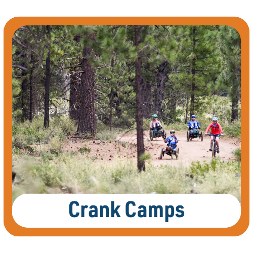 Graphic with text reading “Crank Camps.” Four cyclists ride along a dirt trail through a pine forest. Trees and low brush surround the trail.
